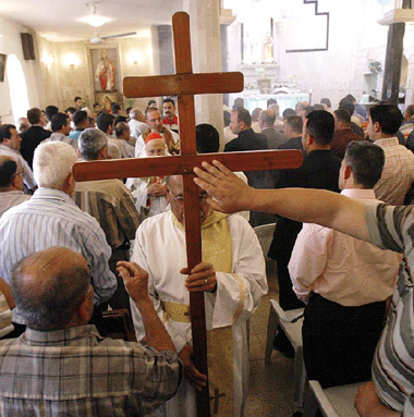 Cristiani in chiesa nel Kurdistan iracheno.